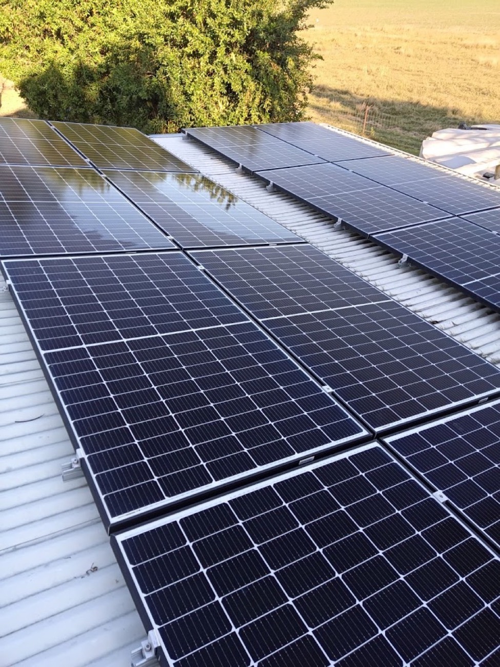 Solar panels on a roof with water running across them