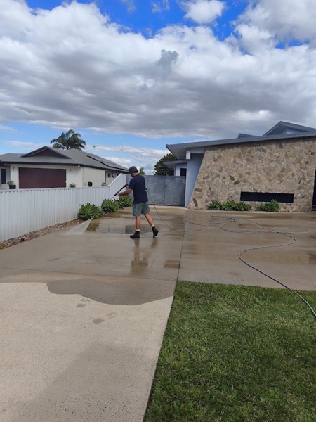 A house with water running across the driveway